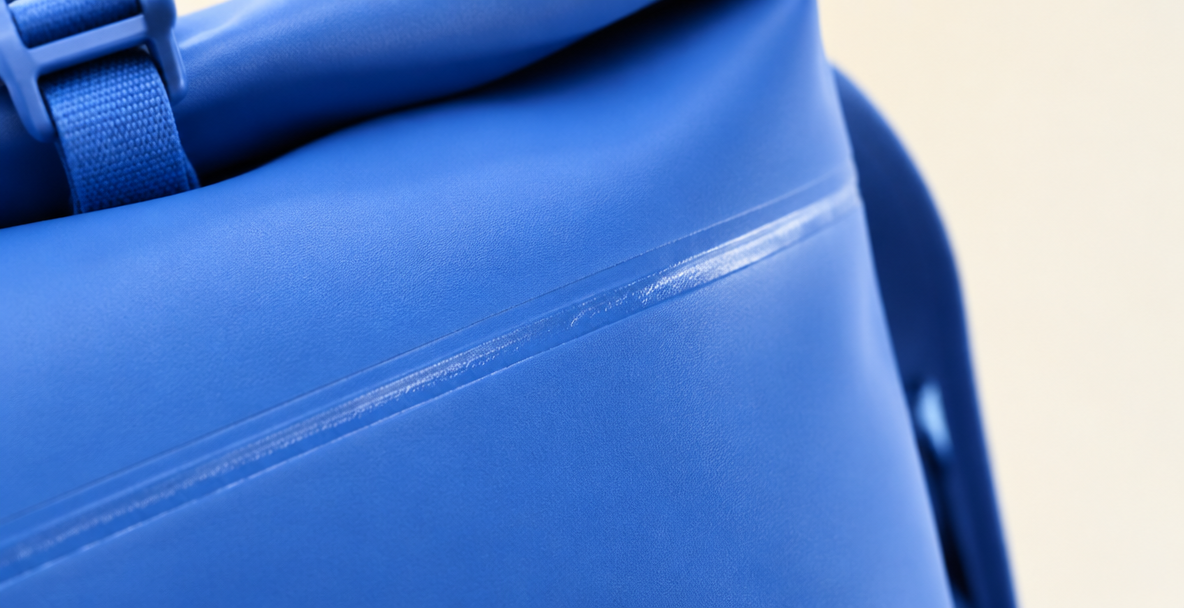 Close-up of a welded seam on the blue backpack fabric