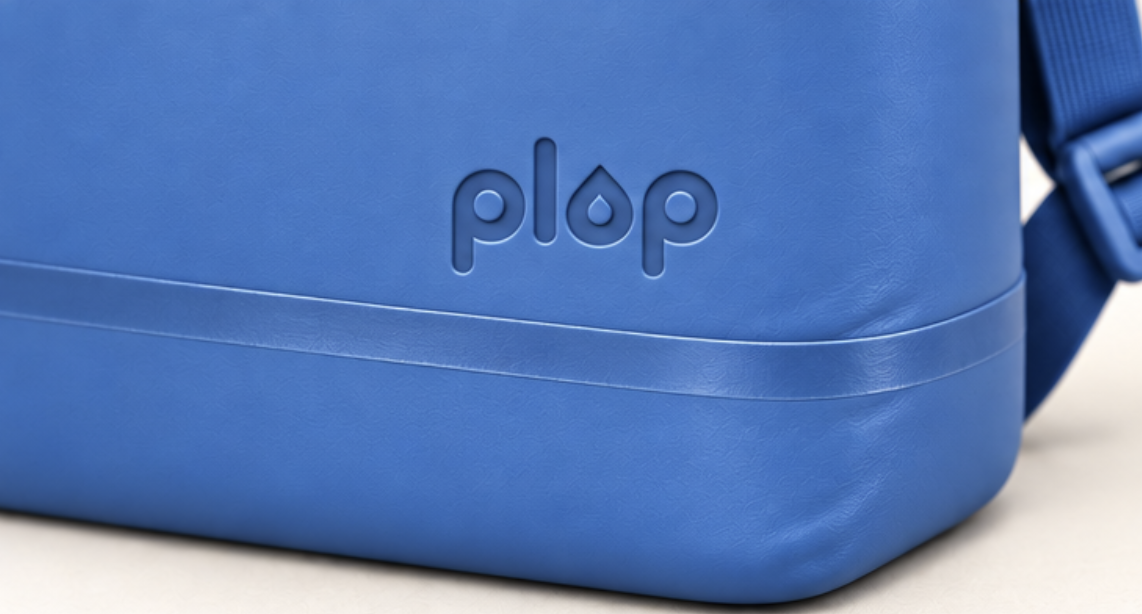 Close-up of the debossed plop logo on the blue backpack