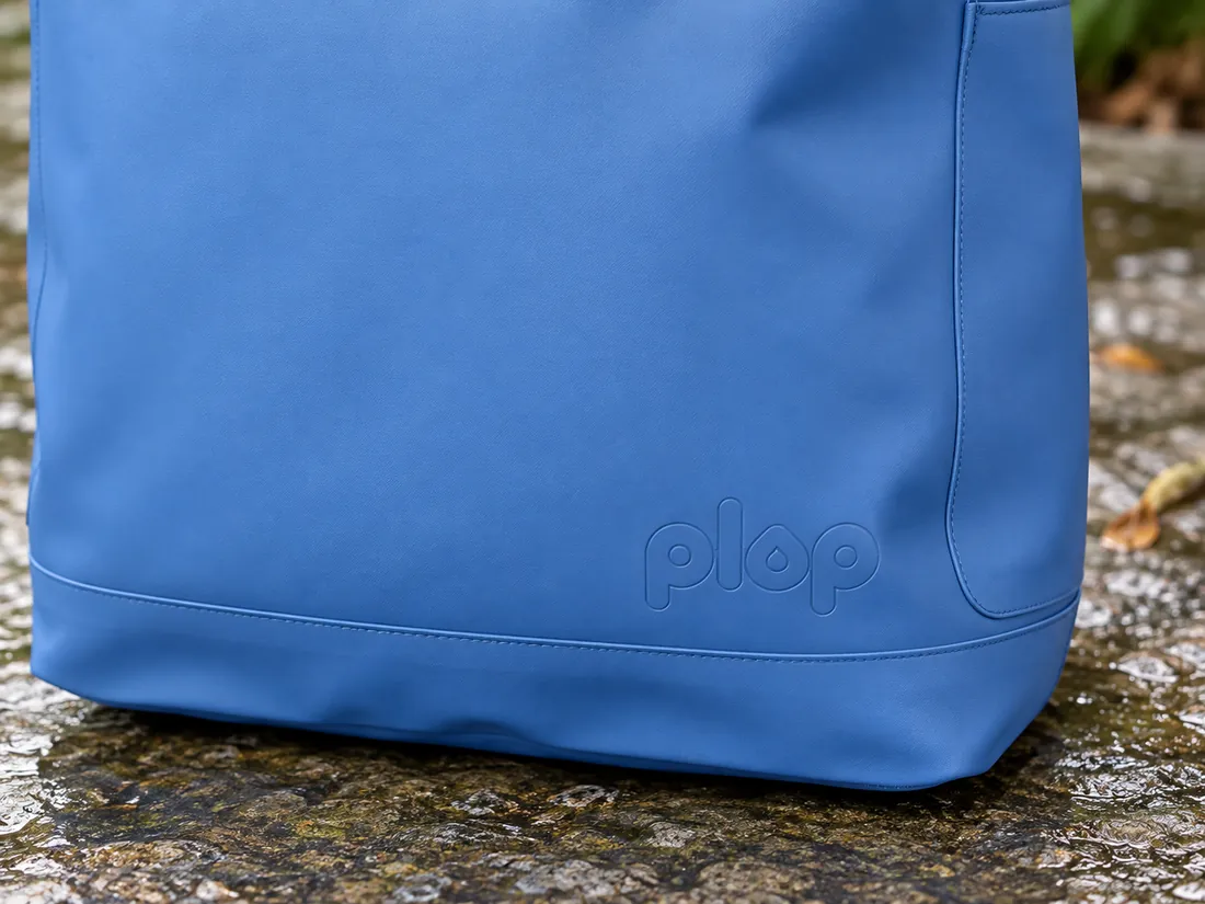 The lower panel and reinforced base of a plop bag